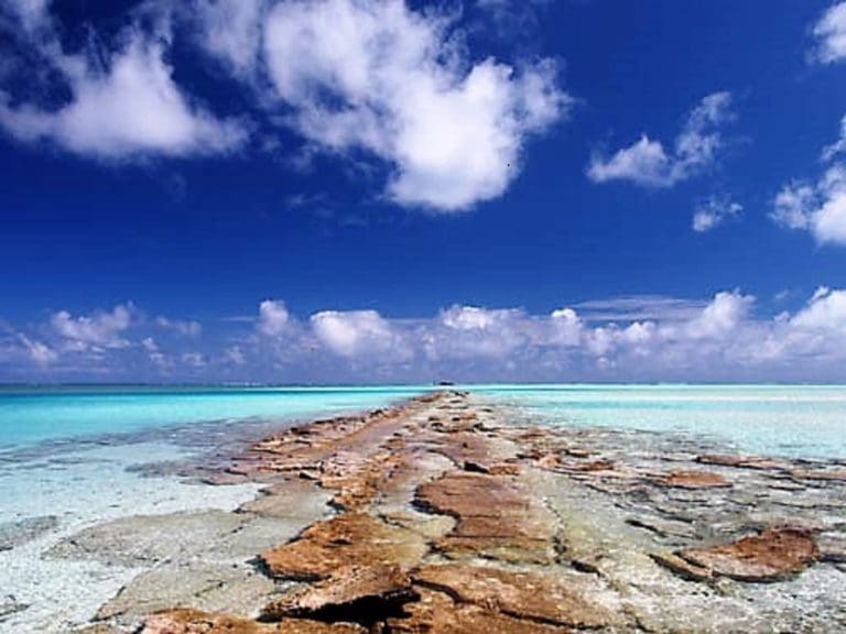 An exposed reef disappearing into the lagoon at Aitutaki