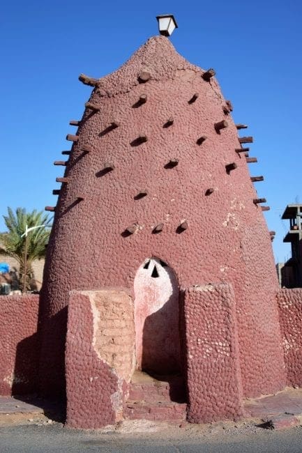 Decorative red mud marabout - beehive saint's tomb - at Timimoun Algeria
